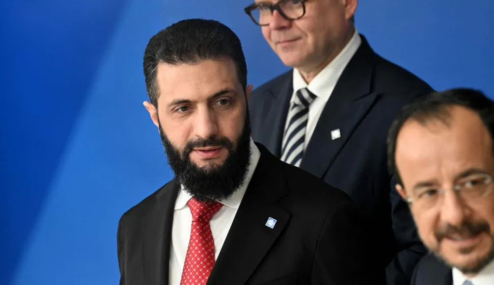 Syria's President Ahmed al-Sharaa (L) takes his position for a family photo after a working session of the European Council and regional partners as part of an informal meeting in Nicosia on April 24, 2026. (Photo by NICOLAS TUCAT/AFP)