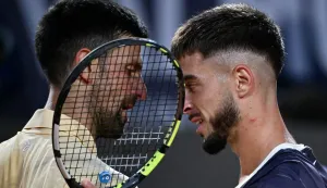 Croatia's Dino Prizmic (R) shakes hands with Serbia's Novak Djokovic after winning their men's singles match of the WTA Rome Open tennis tournament at the Foro Italico in Rome on May 8, 2026. (Photo by Filippo MONTEFORTE/AFP)