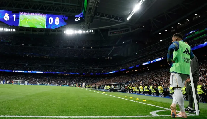 Real Madrid's French forward #10 Kylian Mbappe watches the game from the corner as he warms up during the Spanish league football match between Real Madrid CF and Real Oviedo at Santiago Bernabeu Stadium in Madrid on May 14, 2026. (Photo by Oscar DEL POZO/AFP)