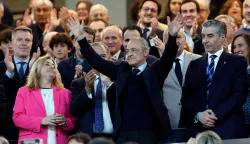Real Madrid president Florentino Perez (C) waves from the stands before the Spanish league football match between Real Madrid CF and Real Oviedo at Santiago Bernabeu Stadium in Madrid on May 14, 2026. Real Madrid officially started their electoral process today, after president Florentino Perez announced his decision to call elections, in which he will stand. There is a 10-day window, until May 23, for the submission of candidacies, Madrid said in a statement. Among the requirements to be a candidate are having been a club member for 20 years and providing a guarantee of 187 million euros (9m), equivalent to 15 percent of the club's annual budget, which must be backed by personal assets. (Photo by Oscar DEL POZO/AFP)