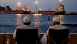 FILE PHOTO: The Galaxy Globe bulk carrier and the Luojiashan tanker sit anchored as Iran vows to close the Strait of Hormuz, amid the U.S.-Israeli conflict with Iran, in Muscat, Oman, March 9, 2026. REUTERS/Benoit Tessier/File Photo Photo: BENOIT TESSIER/REUTERS