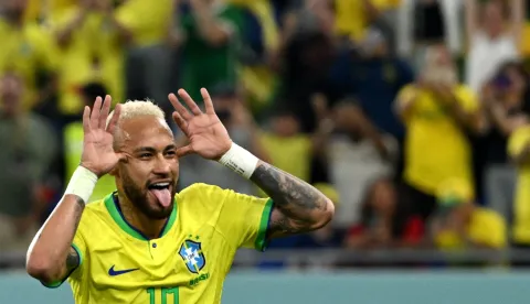 (FILES) Brazil's forward #10 Neymar celebrates scoring his team's second goal from the penalty spot during the Qatar 2022 World Cup round of 16 football match between Brazil and South Korea at Stadium 974 in Doha on December 5, 2022. Brazil superstar Neymar was handed a dramatic recall to the country's World Cup squad on May 18, 2026, returning to the national team after a near three-year absence. (Photo by Pablo PORCIUNCULA/AFP)