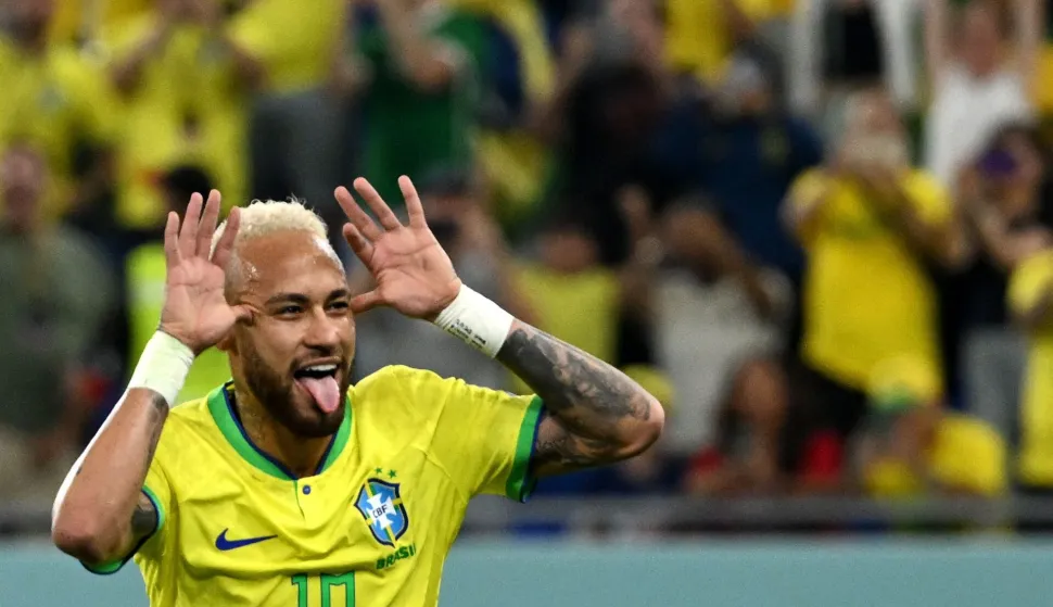 (FILES) Brazil's forward #10 Neymar celebrates scoring his team's second goal from the penalty spot during the Qatar 2022 World Cup round of 16 football match between Brazil and South Korea at Stadium 974 in Doha on December 5, 2022. Brazil superstar Neymar was handed a dramatic recall to the country's World Cup squad on May 18, 2026, returning to the national team after a near three-year absence. (Photo by Pablo PORCIUNCULA/AFP)