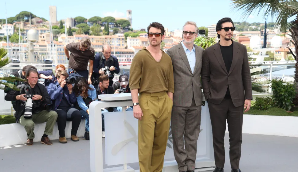 Miles Teller, James Gray and Adam Driver pose at the photocall of 'Paper Tiger' during the 79th Cannes Film Festival at Palais des Festivals in Cannes, France, on 17 May 2026.
