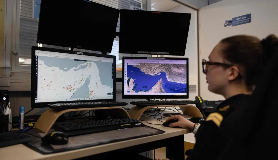 A worker of the Maritime International Cooperation and Awareness (MICA) center looks at screens at the MICA in Brest, western France on April 27, 2026. Attacks on oil tankers in the Strait of Hormuz, piracy off the coast of Somalia, drug trafficking: with their eyes fixed on screens crammed with maps, a dozen sailors at the MICA Centre monitor the world?s maritime hotspots in real time.Since the start of the war in the Middle East, triggered by Israeli-American strikes on Iran on February 28, 2026, this French centre of expertise in maritime security, attached to the French Navy, has been providing invaluable support to civilian vessels and crews stranded in the Persian Gulf. (Photo by Fred TANNEAU/AFP)