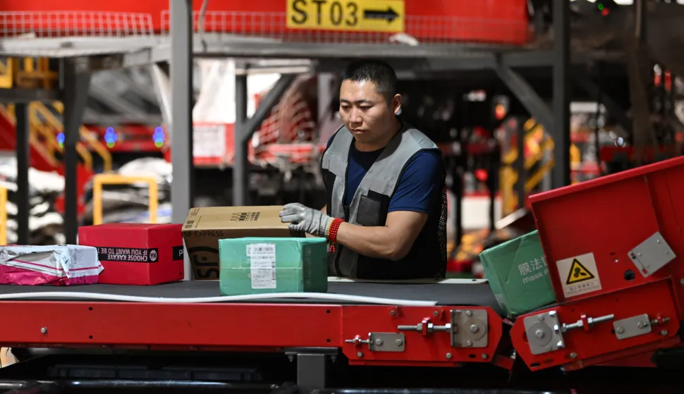 (240618) -- TIANJIN, June 18, 2024 (Xinhua) -- A worker sorts parcels at a transit hub of SF Express in Tianjin, north China, June 18, 2024. During the country's mid-year shopping spree, known as the "618" shopping festival, e-commerce and logistics companies, as well as online and offline enterprises, have prepared well to cope with the surging demand. (Xinhua/Li Ran) Photo: Li Ran/XINHUA