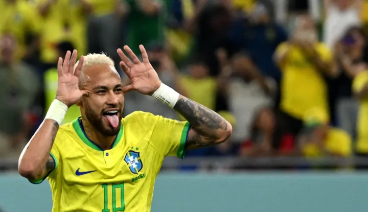 (FILES) Brazil's forward #10 Neymar celebrates scoring his team's second goal from the penalty spot during the Qatar 2022 World Cup round of 16 football match between Brazil and South Korea at Stadium 974 in Doha on December 5, 2022. Brazil superstar Neymar was handed a dramatic recall to the country's World Cup squad on May 18, 2026, returning to the national team after a near three-year absence. (Photo by Pablo PORCIUNCULA/AFP)