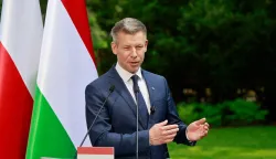 Hungary's Prime Minister Peter Magyar gestures as he holds a joint press conference with Poland's Prime Minister at the garden of the Prime Minister's residency in Warsaw, Poland, on May 20, 2026. Hungary's new Prime Minister Peter Magyar is on a two-day visit to Poland for his first official trip abroad, hoping to mark his country's re-alignment with the European Union after years of open conflict under his predecessor. (Photo by Wojtek RADWANSKI/AFP)