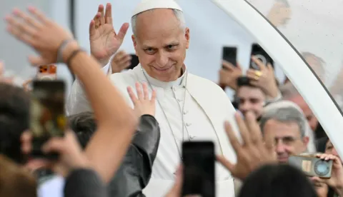 Pope Leo XIV waves to the crowd during a meeting with citizens at Piazza del Plebiscito as part of a pastoral visit in Naples on May 8, 2026. (Photo by Alberto PIZZOLI/AFP)