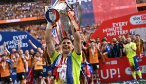 Hull City's Croatian goalkeeper #01 Ivor Pandur celebrates with the trophy after the English Championship play-off final football match between Hull City and Middlesbrough at Wembley Stadium in London on May 23, 2026. Hull won the game 1-0. (Photo by Paul ELLIS/AFP)/NOT FOR MARKETING OR ADVERTISING USE/RESTRICTED TO EDITORIAL USE