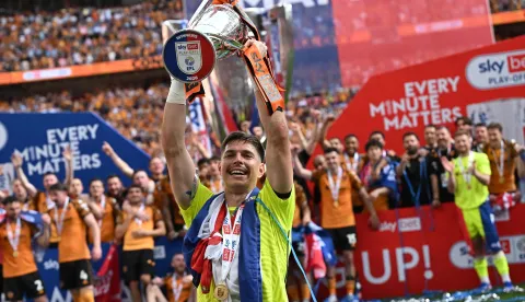 Hull City's Croatian goalkeeper #01 Ivor Pandur celebrates with the trophy after the English Championship play-off final football match between Hull City and Middlesbrough at Wembley Stadium in London on May 23, 2026. Hull won the game 1-0. (Photo by Paul ELLIS/AFP)/NOT FOR MARKETING OR ADVERTISING USE/RESTRICTED TO EDITORIAL USE