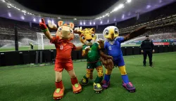 Mascots of the World Cup Maple the Moose (L), Zayu the Jaguar (C) and Clutch the Bald Eagle pose for a picture during the 2026 FIFA World Cup qualifiers semi-final playoff football match between New Caledonia and Jamaica at the Akron Stadium in Zapopan, Mexico on March 26, 2026. (Photo by Ulises Ruiz/AFP)