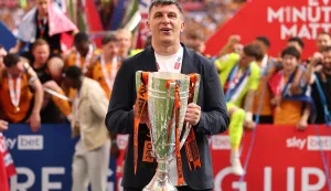 Soccer Football - Championship - Play Off - Final - Hull City v Middlesbrough - Wembley Stadium, London, Britain - May 23, 2026 Hull City manager Sergej Jakirovic celebrates with the trophy after winning the Championship Play Off Final REUTERS/David Klein EDITORIAL USE ONLY. NO USE WITH UNAUTHORIZED AUDIO, VIDEO, DATA, FIXTURE LISTS, CLUB/LEAGUE LOGOS OR 'LIVE' SERVICES. ONLINE IN-MATCH USE LIMITED TO 120 IMAGES, NO VIDEO EMULATION. NO USE IN BETTING, GAMES OR SINGLE CLUB/LEAGUE/PLAYER PUBLICATIONS. PLEASE CONTACT YOUR ACCOUNT REPRESENTATIVE FOR FURTHER DETAILS.. Photo: David Klein/REUTERS