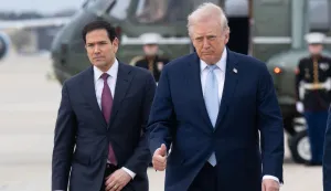 (FILES) US President Donald Trump and US Secretary of State Marco Rubio walk to board Air Force One prior to departure from Joint Base Andrews in Maryland, March 20, 2026, as they travel to Florida for the weekend. US President Donald Trump said on May 23 that Iran and the US had "largely negotiated" a deal that included opening the Strait of Hormuz, but the draft was "subject to finalization." (Photo by SAUL LOEB/AFP)