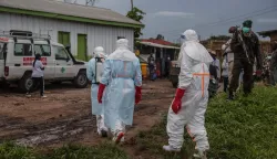 Medical staff wearing personal protective equipment (PPE) walk at the hospital in Rwampara on May 21, 2026. According to the WHO, the latest outbreak in the DRC, the 17th to hit the vast central African country of more than 100 million people, is already suspected of having caused 139 deaths out of nearly 600 probable cases.Many of the cases have been recorded in the epidemic's epicentre in the DRC's northeastern Ituri province, many in hard-to-access areas plagued by the Congolese east's litany of armed groups. (Photo by Seros MUYISA/AFP)