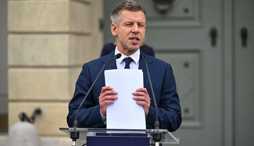Hungary?s Prime Minister Peter Magyar handles paper sheets during a door-step presser after a meeting with Hungary's President at the presidential office in Sandor-palace, Budapest, Hungary, on June 1, 2026. The meeting takes place a day after a deadline set out by Magyar for the resignation of Sulyok has passed. The prime minister has urged top state officials, whom he called puppets of his predecessor, to step down by the end of May or face removal from office. (Photo by Attila KISBENEDEK/AFP)
