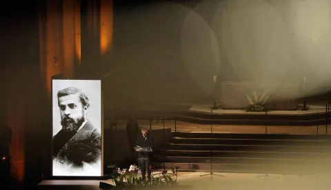 (FILES) A portrait of Spanish architect Antoni Gaudi is seen during a ceremony marking the 100th anniversary of the completion of the Sagrada Familia Basilica's Bernabe Tower, in Barcelona, on November 30, 2025. Antoni Gaudi was an extraordinary architect, creator of the Sagrada Familia and Park G?ell, and an icon of tourist Barcelona, but also a devout Catholic who is now ever closer to the beatification once envisioned for him by a group of admirers in Barcelona. Almost five million people entered the Sagrada Familia with a ticket last year, making it the most visited paid monument in Spain, while Gaud?s major works rank among the most in-demand attractions in the city. (Photo by Manaure QUINTERO/AFP)