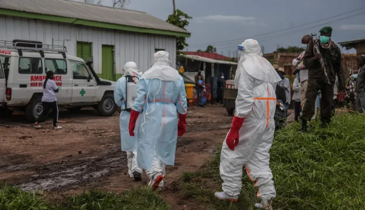 Medical staff wearing personal protective equipment (PPE) walk at the hospital in Rwampara on May 21, 2026. According to the WHO, the latest outbreak in the DRC, the 17th to hit the vast central African country of more than 100 million people, is already suspected of having caused 139 deaths out of nearly 600 probable cases.Many of the cases have been recorded in the epidemic's epicentre in the DRC's northeastern Ituri province, many in hard-to-access areas plagued by the Congolese east's litany of armed groups. (Photo by Seros MUYISA/AFP)