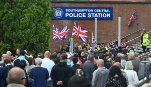 Demonstrators protest outside of Southampton Central Police Station in Southampton, southern England, on June 2, 2026, following the conviction of Vickrum Digwa for the murder of Henry Nowak. Body camera footage of a dying student who was handcuffed by British police after being stabbed by a Sikh man and falsely accused of racially abusing his murderer sparked outrage Tuesday. (Photo by JUSTIN TALLIS/AFP)