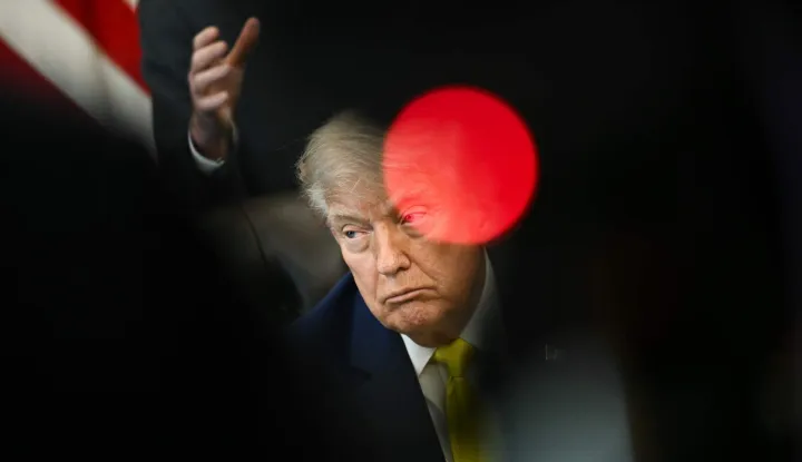 US President Donald Trump looks on during an announcement about coal, in the Oval Office of the White House in Washington, DC on June 4, 2026. President Trump on Thursday announced he was using Cold War era legislation to tap 0 million in funding for a slew of coal plants and mines and an export terminal. (Photo by Brendan SMIALOWSKI/AFP)