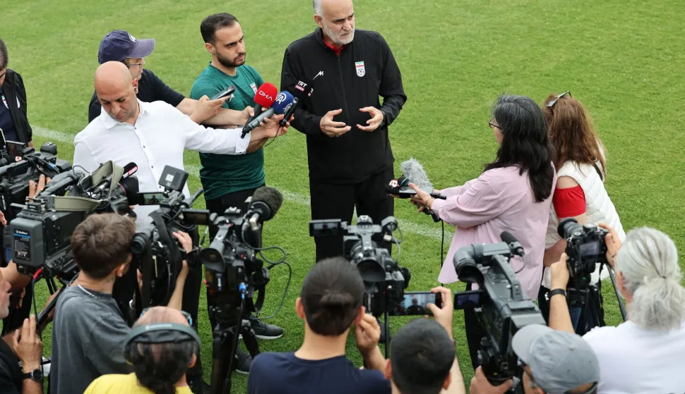 First Vice President of the Islamic Republic of Iran Football Federation Mahdi Mohammadnabi (C) addresses the media during a training session at the Iranian team's base camp in Antalya on May 19, 2026. Iran's national football team arrived in Turkey on May 19, 2026 for a training camp and to complete visa applications ahead of the 2026 World Cup, AFP correspondents said. (Photo by Oner SAN/AFP)