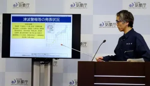An official from the Japan Meteorological Agency's Earthquake and Tsunami Countermeasures Planning Office holds a press conference in Tokyo on June 8, 2026, regarding a tsunami warning issued in response to an offshore earthquake that struck some 24 kilometres west of Mindanao island in the southern Phlippines. Japanese authorities issued a tsunami advisory on June 8 along swathes of its Pacific coast after a major earthquake off the Philippines. (Photo by JIJI PRESS/AFP)/Japan OUT