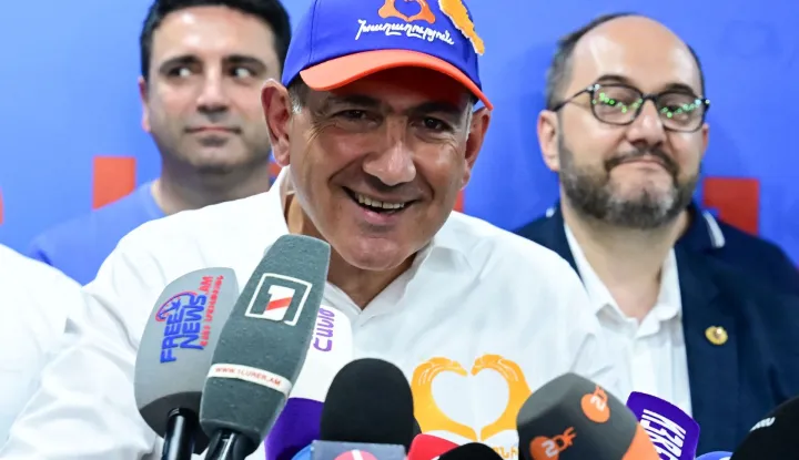 Armenian Prime Minister and leader of the Civil Contract party Nikol Pashinyan holds a press conference following the parliamentary election at the party's headquarters in Yerevan early on June 8, 2026. (Photo by Karen MINASYAN/AFP)