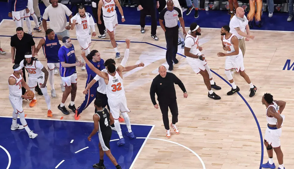 NEW YORK, NEW YORK - JUNE 10: Members of the New York Knicks celebrate their 107-106 victory against the San Antonio Spurs in Game Four of the 2026 NBA Finals at Madison Square Garden on June 10, 2026 in New York City. NOTE TO USER: User expressly acknowledges and agrees that, by downloading and or using this photograph, User is consenting to the terms and conditions of the Getty Images License Agreement. Dustin Satloff/Getty Images/AFP (Photo by Dustin Satloff/GETTY IMAGES NORTH AMERICA/Getty Images via AFP)