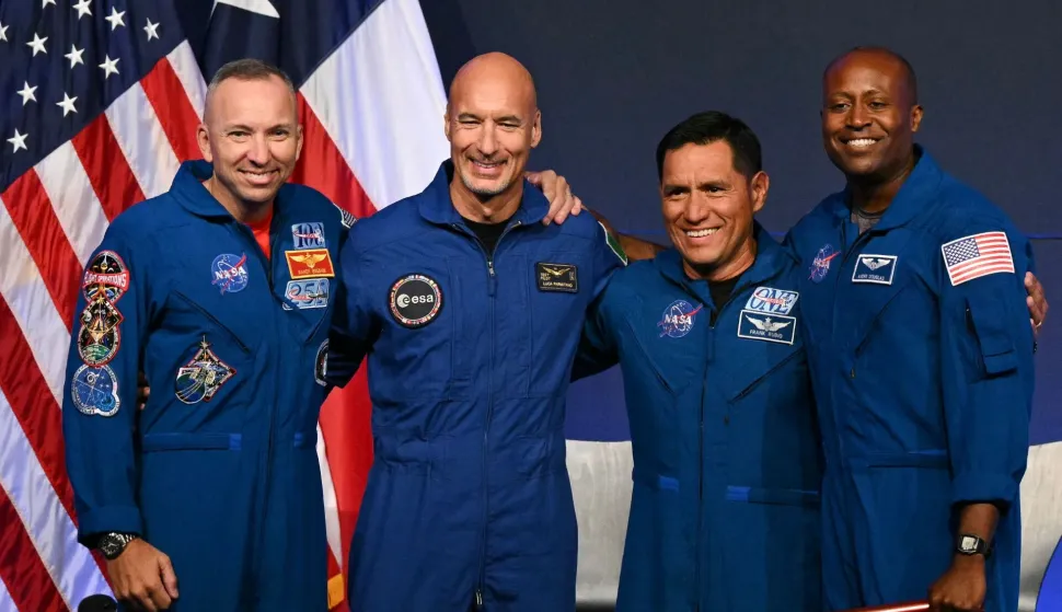 (L/R) NASA astronaut commander Randy Bresnik, ESA (European Space Agency) astronaut pilot Luca Parmitano, NASA astronaut mission specialist Frank Rubio, and NASA astronaut mission specialist Andre Douglas speak during a press conference announcing the crew for the Artemis III mission at NASA's Johnson Space Center in Houston, Texas, on June 9, 2026. The Italian Luca Parmitano will be the pilot of NASA's Artemis 3 voyage, the first European to join one of the program's missions. Parmitano, who will represent the European Space Agency, is one of four men named as crewmembers tasked with carrying out Artemis 3, which is targeting launch in late 2027. (Photo by RONALDO SCHEMIDT/AFP)