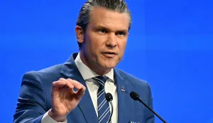 (FILES) US Secretary of Defense Pete Hegseth delivers an address at the Shangri-La Dialogue Summit in Singapore on May 31, 2025. The evolving relationship between Washington and Beijing will take centre stage this weekend as Asia's top defence summit opens in Singapore on May 29, 2026, against the backdrop of a fragile stalemate in the US-Iran war and fresh uncertainties over Taiwan. (Photo by MOHD RASFAN/AFP)
