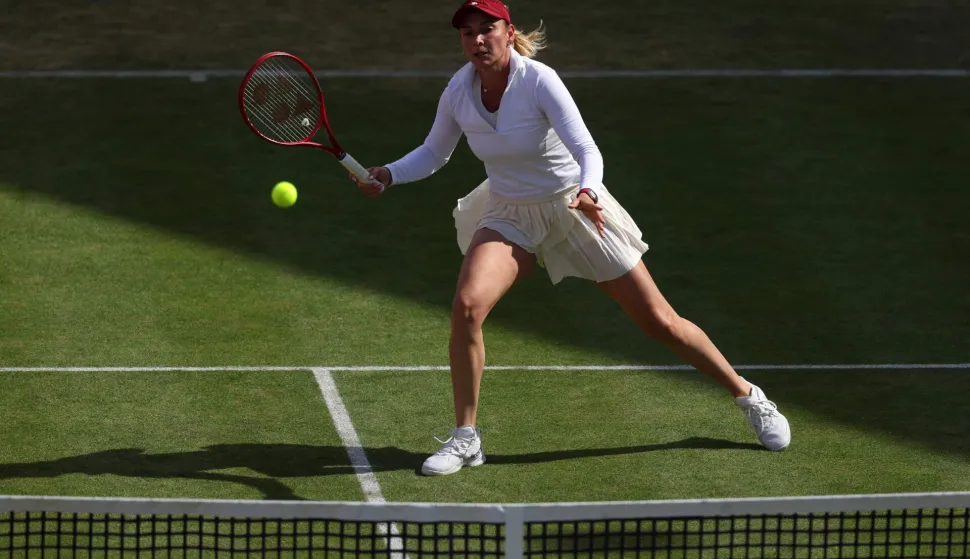 Croatia's Donna Vekic returns against Czech Republic's Karolina Pliskova during their women's singles quarter-final tennis match at the HSBC WTA Championships at Queen's Club in west London on June 12, 2026. (Photo by Adrian Dennis/AFP)