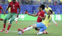 (260614) -- NEW YORK, June 14, 2026 (Xinhua) -- Matheus Cunha (R) of Brazil vies with Ayyoub Bouaddi (C) of Morocco during the group C match between Brazil and Morocco at the 2026 FIFA World Cup at New York New Jersey Stadium in New York, the United States, June 13, 2026. (Xinhua/Cao Can) Photo: Cao Can/XINHUA