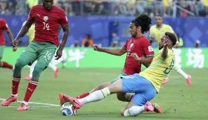 (260614) -- NEW YORK, June 14, 2026 (Xinhua) -- Matheus Cunha (R) of Brazil vies with Ayyoub Bouaddi (C) of Morocco during the group C match between Brazil and Morocco at the 2026 FIFA World Cup at New York New Jersey Stadium in New York, the United States, June 13, 2026. (Xinhua/Cao Can) Photo: Cao Can/XINHUA