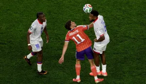 FOXBOROUGH, MASSACHUSETTS - JUNE 13: Ryan Christie #11 of Scotland competes for the ball against Hannes Delcroix #5 and Jean-Ricner Bellegarde #10 of Haiti during the FIFA World Cup 2026 Group C match between Haiti and Scotland at Boston Stadium on June 13, 2026 in Foxborough, Massachusetts. Mattia Ozbot/Getty Images/AFP (Photo by Mattia Ozbot/GETTY IMAGES NORTH AMERICA/Getty Images via AFP)