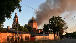 This photograph shows smoke rising above a church following an air attack in Kharkiv on June 10, 2026, amid the Russian invasion of Ukraine. (Photo by SERGEY BOBOK/AFP)