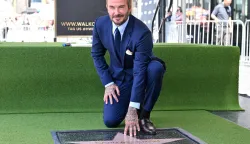 English former footballer David Beckham poses at his newly unveiled Hollywood Walk of Fame star during a ceremony in Hollywood, California, on June 12, 2026. (Photo by LISA O'CONNOR/AFP)