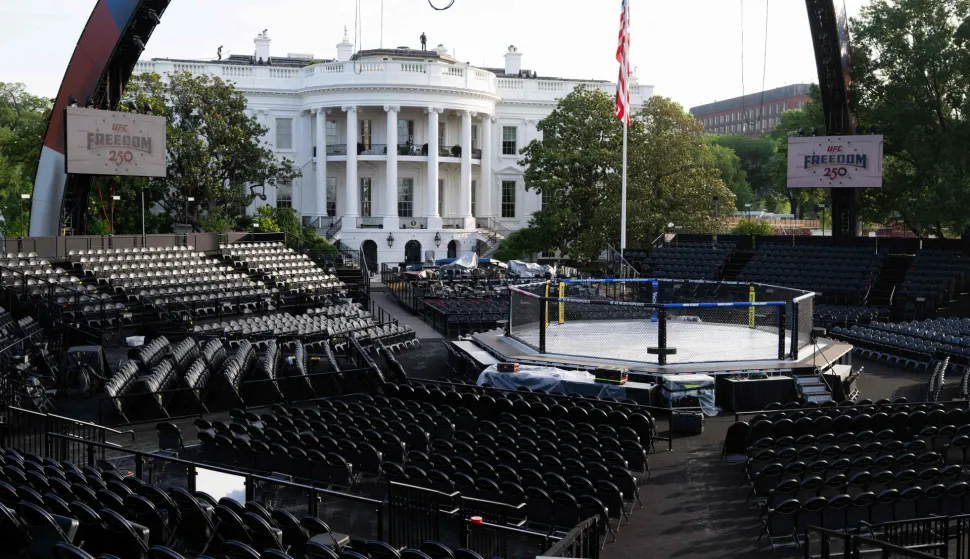 Seating and "The Octagon" fighting enclosure for the upcoming UFC fight that US President Donald Trump will host as part of the 250th anniversary of the United States is seen on the South Lawn of the White House during a media preview in Washington, DC, June 11, 2026. The Ultimate Fighting Championship (UFC) event will be held on US President Donald Trump's 80th birthday on June 14. (Photo by SAUL LOEB/AFP)