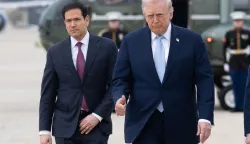 (FILES) US President Donald Trump and US Secretary of State Marco Rubio walk to board Air Force One prior to departure from Joint Base Andrews in Maryland, March 20, 2026, as they travel to Florida for the weekend. US President Donald Trump said on May 23 that Iran and the US had "largely negotiated" a deal that included opening the Strait of Hormuz, but the draft was "subject to finalization." (Photo by SAUL LOEB/AFP)