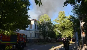 Firefighters work near the damaged Kharkiv Art Museum following a drone strike in Kharkiv on June 14, 2026, amid the Russian invasion of Ukraine. (Photo by SERGEY BOBOK/AFP)
