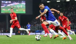 epa11392255 Kylian Mbappe of France (R) in action against Eldin Dzogovic of Luxemburg (L) during the international friendly soccer match between France and Luxembourg, Metz, France, 05 June 2024. EPA/CHRISTOPHER NEUNDORF