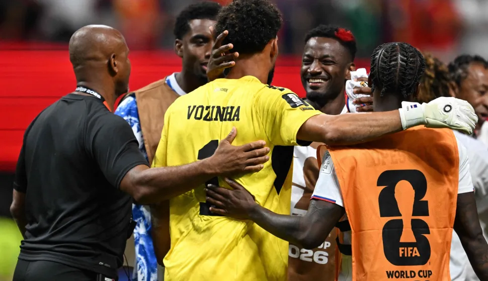 Cape Verde's goalkeeper #01 Vozinha (C) is congratulated by staff and teammates at the end of the 2026 World Cup Group H football match between Spain and Cape Verde at the Atlanta Stadium in Atlanta on June 15, 2026. (Photo by Roberto SCHMIDT/AFP)