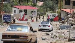 Lebanese soldiers set up a checkpoint in the southern village of Kafra, closing the road leading to the nearby village of Haris, where the Israeli military remains present, on June 15, 2026. Israel's defence minister said on June 15, that Israeli forces would remain in Lebanon, Syria and Gaza indefinitely, hours after the United States and Iran agreed to end the Middle East war, including in Lebanon. (Photo by Kawnat HAJU/AFP)/