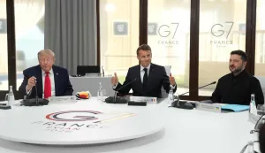 (From L) US President Donald Trump, France's President Emmanuel Macron and Ukraine's President Volodymyr Zelensky take part in a working session at the G7 summit in Evian-les-Bains, central-eastern France on June 16, 2026. (Photo by Thibault Camus/POOL/AFP)