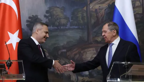 Russian Foreign Minister Sergei Lavrov and his Turkish counterpart Hakan Fidan shake hands during a joint press conference following their meeting in Moscow on June 16, 2026. (Photo by SERGEI ILNITSKY/POOL/AFP)