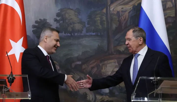 Russian Foreign Minister Sergei Lavrov and his Turkish counterpart Hakan Fidan shake hands during a joint press conference following their meeting in Moscow on June 16, 2026. (Photo by SERGEI ILNITSKY/POOL/AFP)