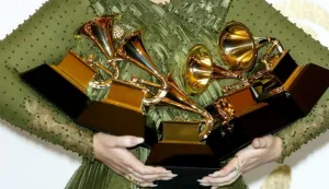 epa05790152 Adele holds up her awards in the press room during the 59th annual Grammy Awards ceremony at the Staples Center in Los Angeles, California, USA, 12 February 2017. Adele won the awards Record Of The Year, Album Of The Year, Song Of The Year, Best Pop Solo Performance and Best Pop Vocal Album, with the album '25' and song 'Hello.' EPA/MIKE NELSON