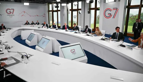 (From L) Germany?s Chancellor Friedrich Merz, India's Prime Minister Narendra Modi, US President Donald Trump, France's President Emmanuel Macron, Kenya's President William Ruto, Italy's Prime Minister Giorgia Meloni, South Korea's President Lee Jae-myung and European Commission President Ursula von der Leyen attend a work meeting as part of the G7 summit, in Evian, eastern France, on June 16, 2026. A G7 summit is set to take place June 15 to 17 in the French town of Evian-les-Bains near Switzerland and it will be attended by country leaders as well as the EU's foreign policy chief and ministers from Brazil, Canada, the United Arab Emirates and Turkey. (Photo by Mandel NGAN/AFP)