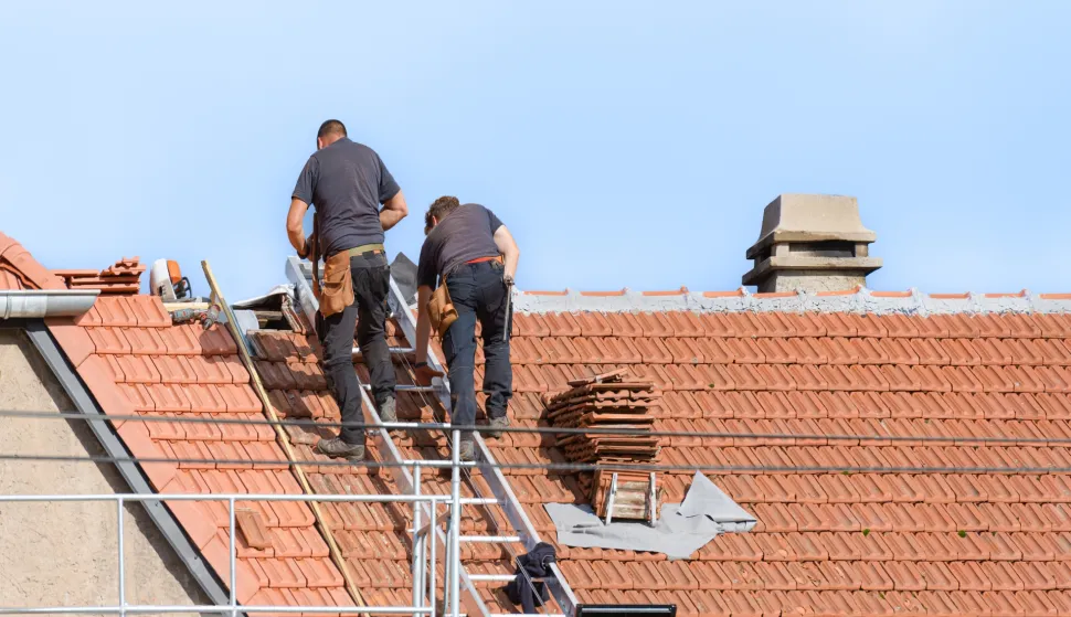 replacement of tile covering on the roof by two roofers