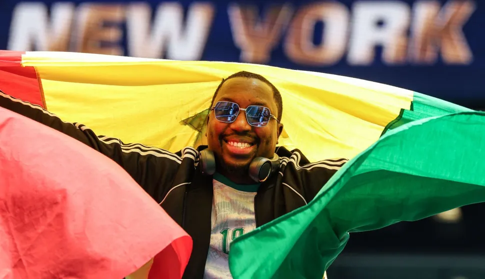 A Senegal fan cheers during the 2026 World Cup Group I football match between France and Senegal at the New York/New Jersey Stadium in East Rutherford on June 16, 2026. (Photo by TIMOTHY A. CLARY/AFP)