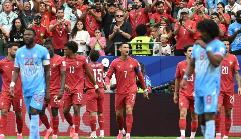 Portugal's forward #07 Cristiano Ronaldo (C) reacts with teammates after his team socred the opening goal during the 2026 World Cup Group K football match between Portugal and the Democratic Republic of Congo at the Houston Stadium in Houston on June 17, 2026. (Photo by RONALDO SCHEMIDT/AFP)